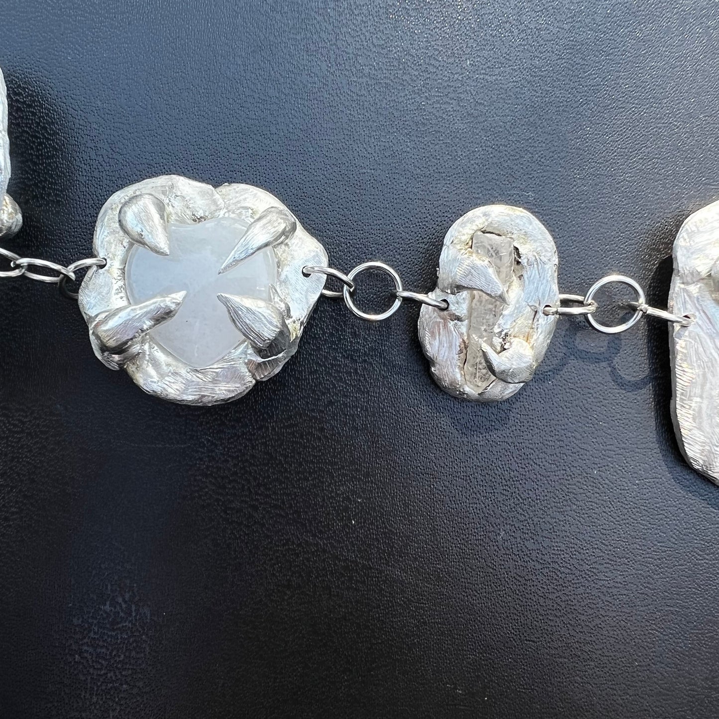 a Held By The Universe Necklace