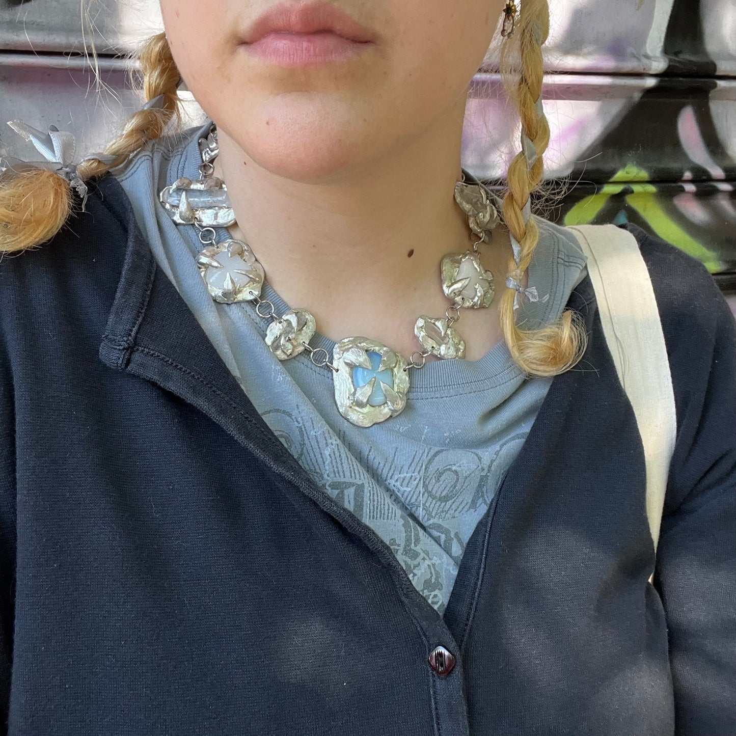 a Held By The Universe Necklace