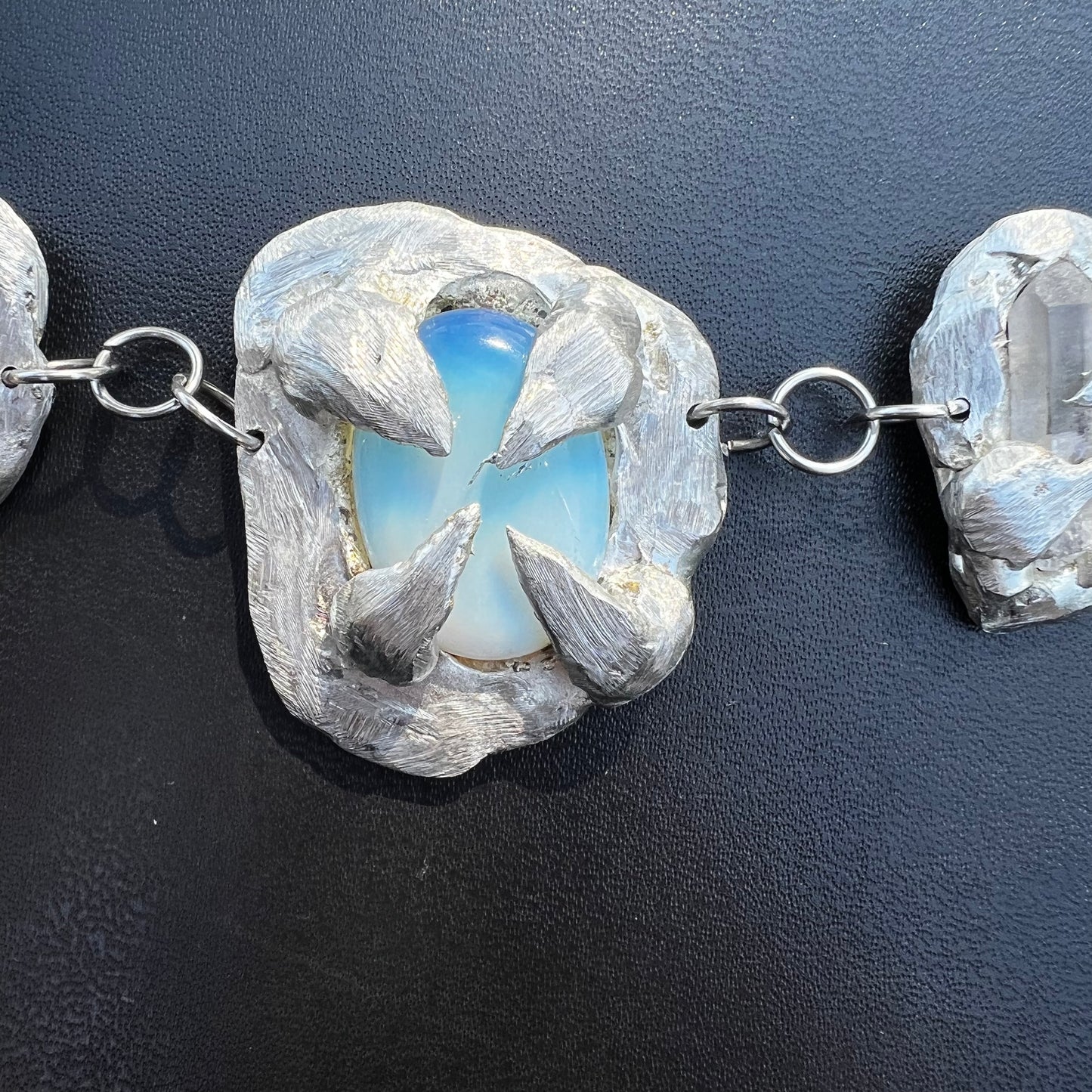 a Held By The Universe Necklace