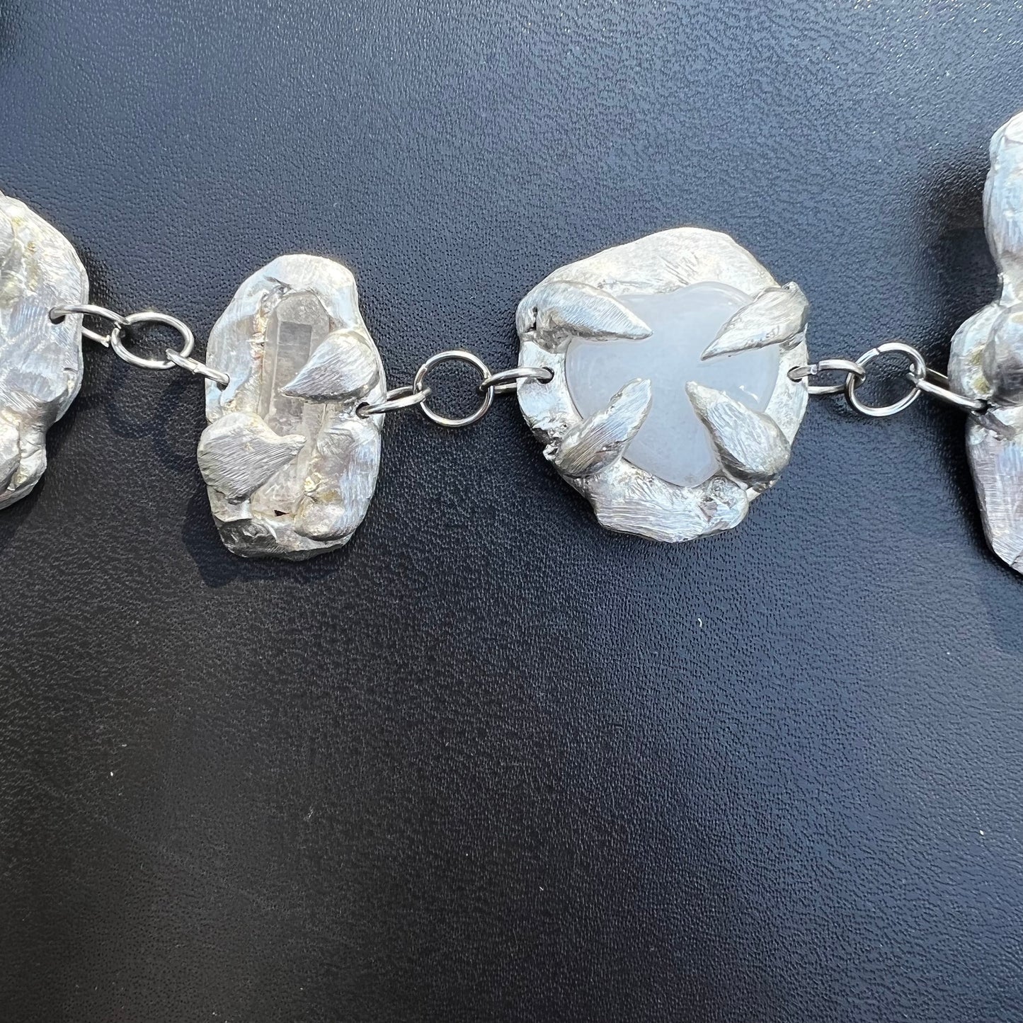 a Held By The Universe Necklace