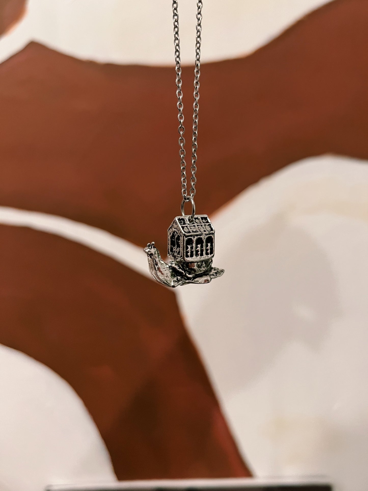 a snail and her greenhouse