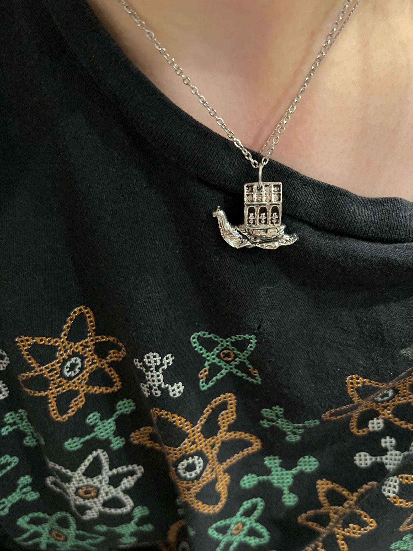 a snail and her greenhouse